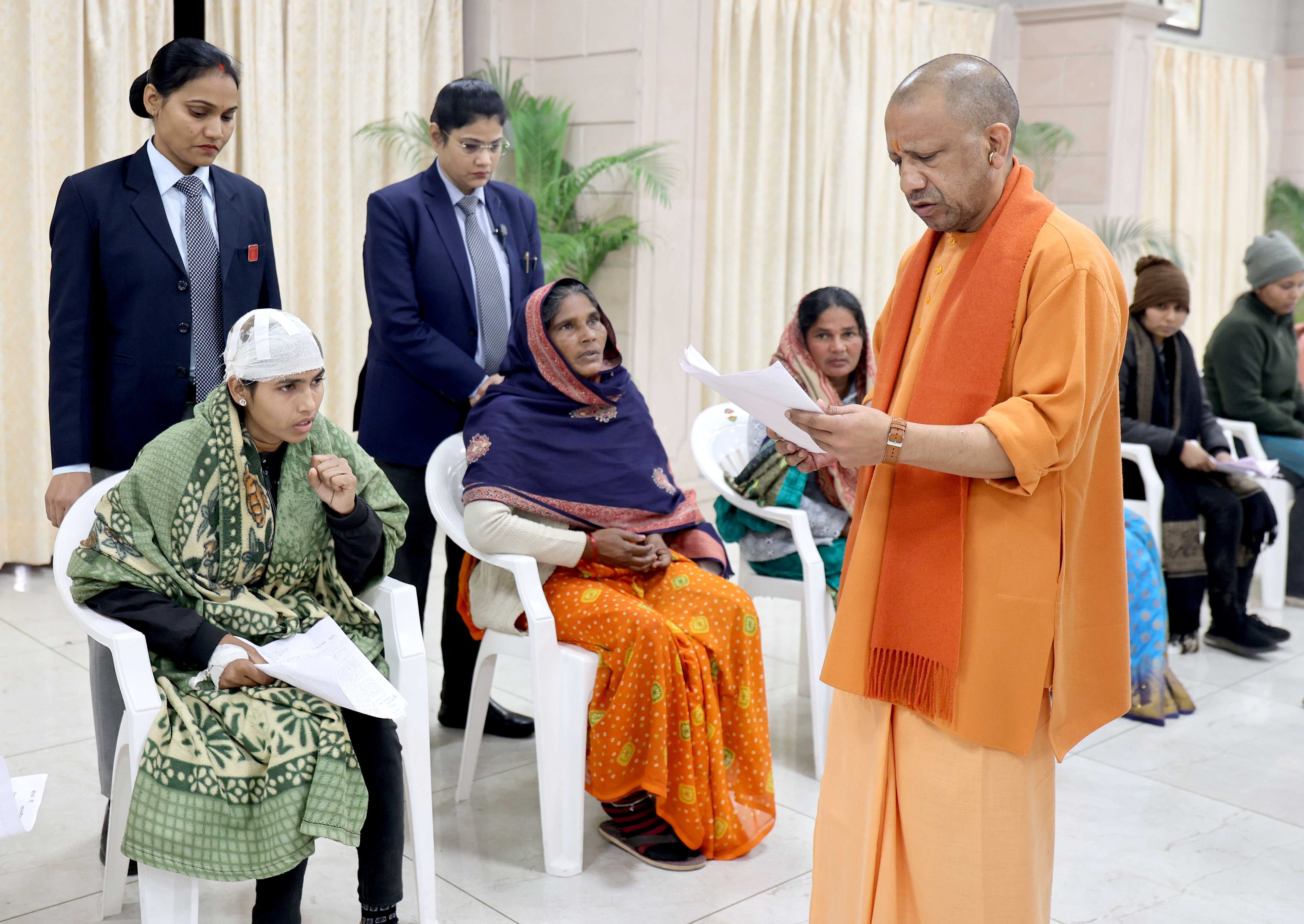 Honorable Chief Minister Yogi Adityanath listening to people's grievances and directing concerned officials to prioritize and resolve public issues expeditiously during a public interaction session held at his official residence, 5 Kalidas Marg, Lucknow, on January 12, 2026.