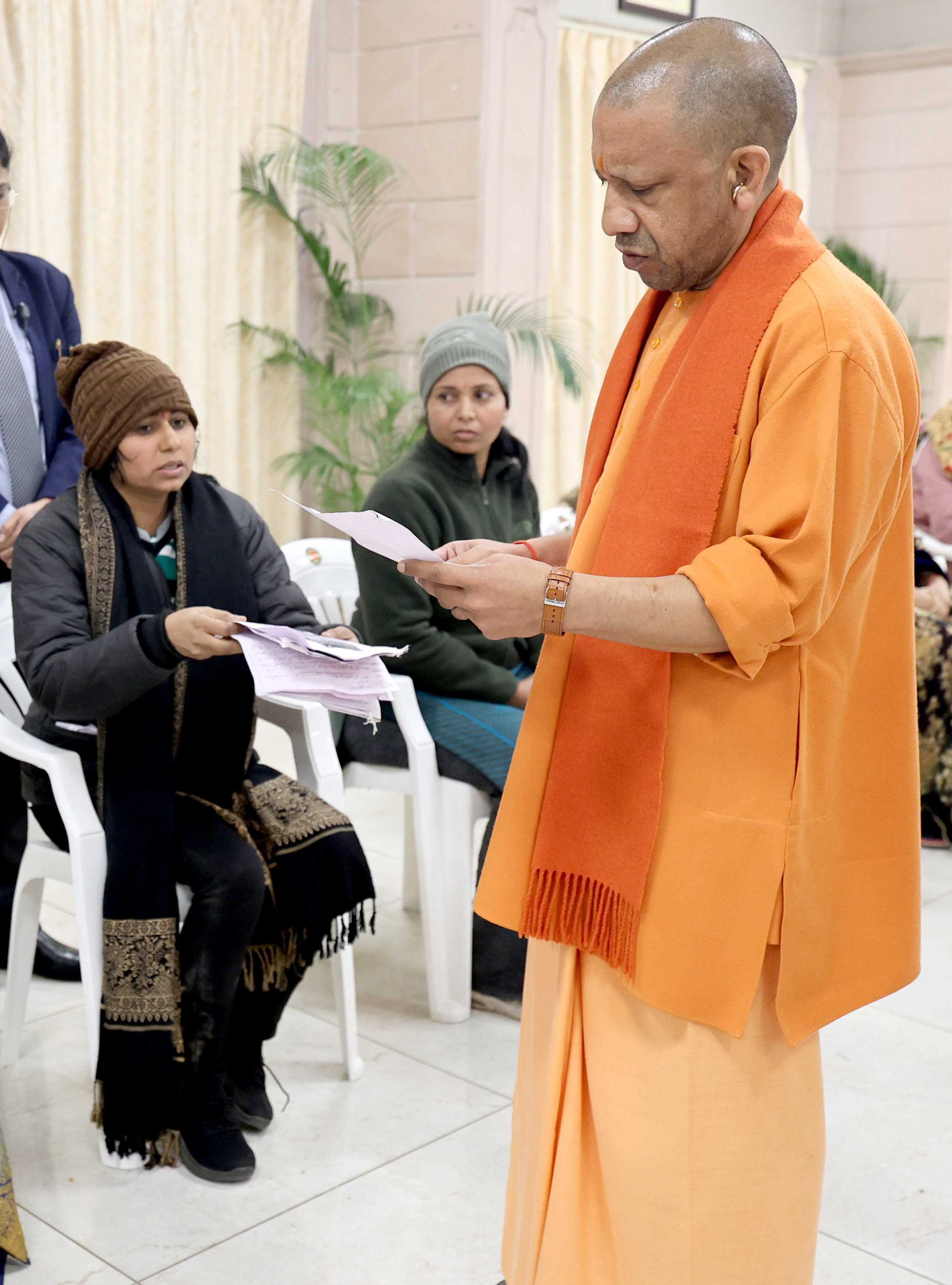 Honorable Chief Minister Yogi Adityanath listening to people's grievances and directing concerned officials to prioritize and resolve public issues expeditiously during a public interaction session held at his official residence, 5 Kalidas Marg, Lucknow, on January 12, 2026.