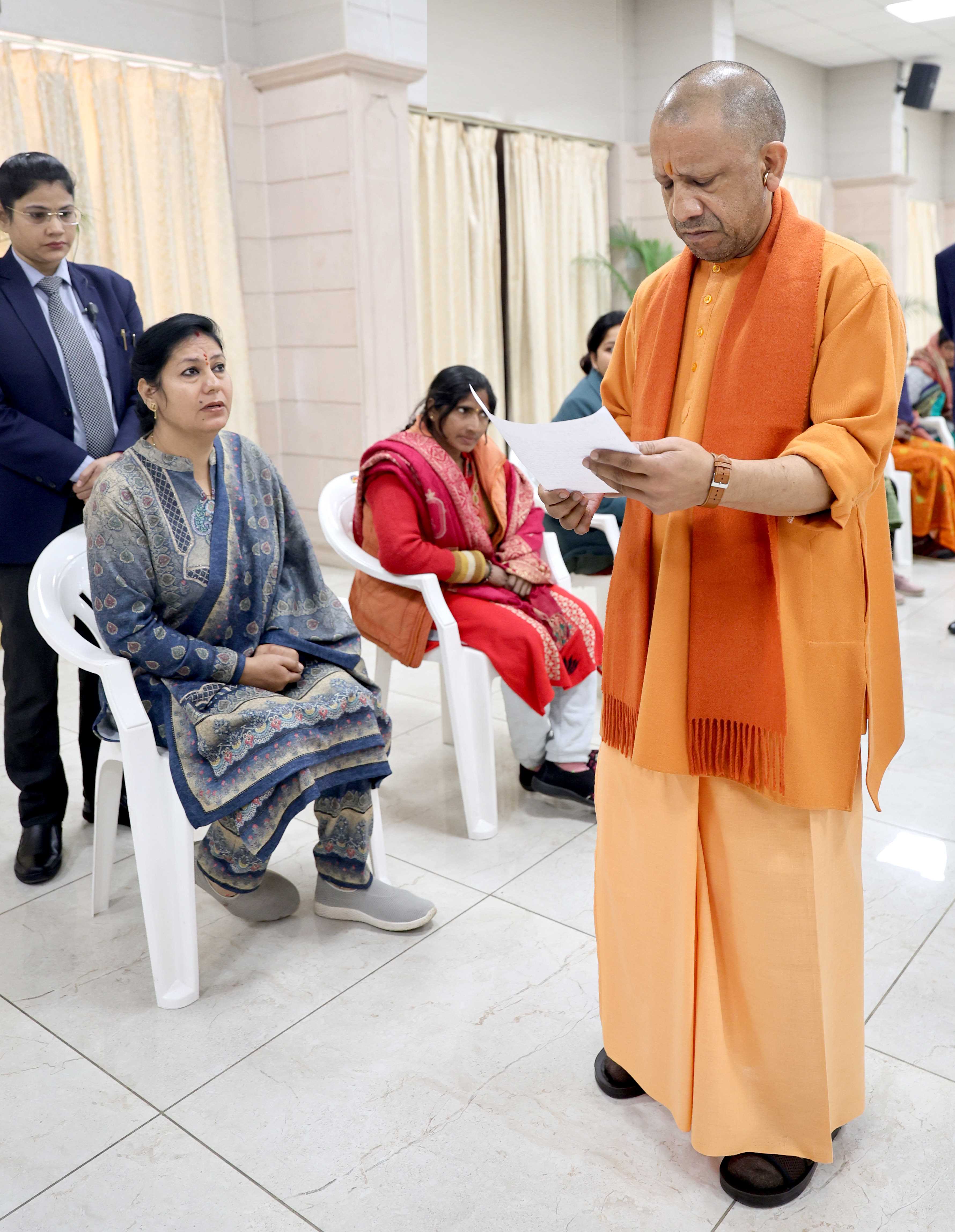 Honorable Chief Minister Yogi Adityanath listening to people's grievances and directing concerned officials to prioritize and resolve public issues expeditiously during a public interaction session held at his official residence, 5 Kalidas Marg, Lucknow, on January 12, 2026.
