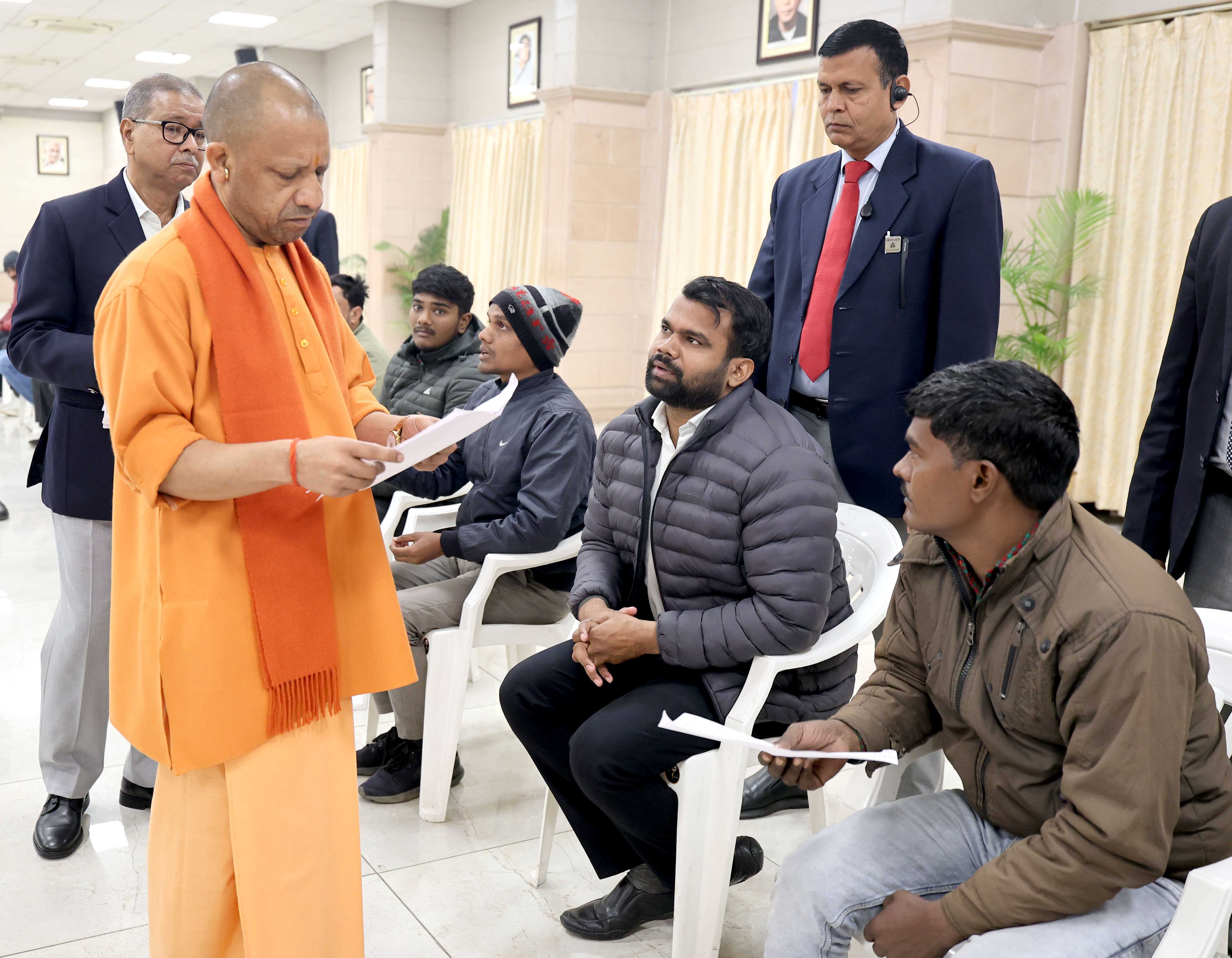 Honorable Chief Minister Yogi Adityanath listening to people's grievances and directing concerned officials to prioritize and resolve public issues expeditiously during a public interaction session held at his official residence, 5 Kalidas Marg, Lucknow, on January 12, 2026.